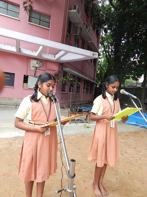 1. Hosts of the day Kumuda R and Navya Lalitha P. of Class 6