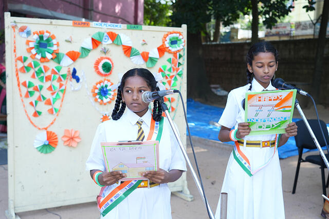 1. Hosts - Dhanvitha V. Taridalu and Arushi K. Chandragiri of Class 7