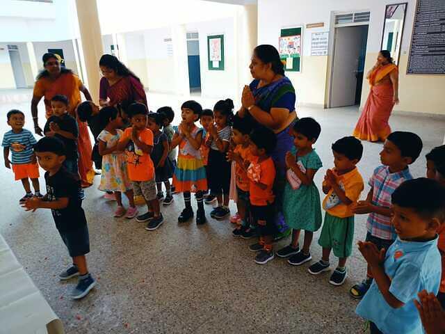 Children praying to goddess saraswati