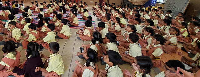 children chanting OM