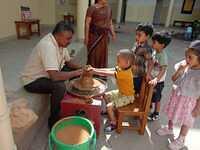 Children learning Pottery making