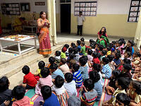 Teacher explaining about deepavali 