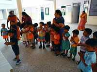 Children praying to goddess saraswati